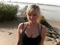 A blonde alone on the beach